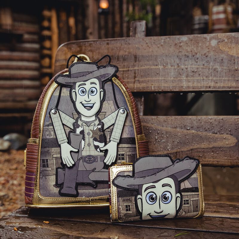 Image of the Woody Puppet Mini Backpack and Wallet side by side against a brown, wooden background